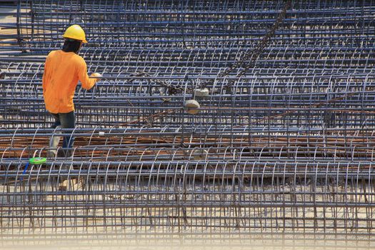 Construction worker And steel bars for tall building structures