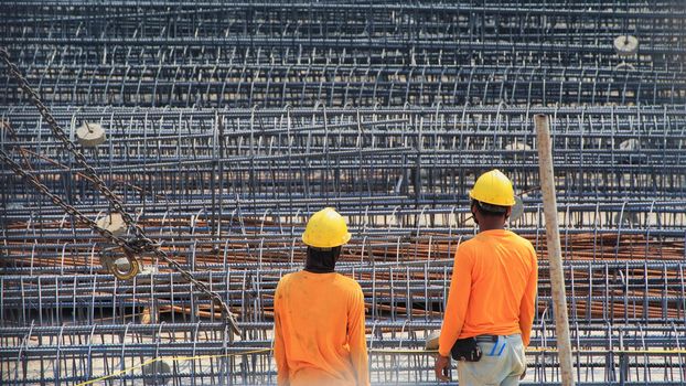 Construction worker And steel bars for tall building structures