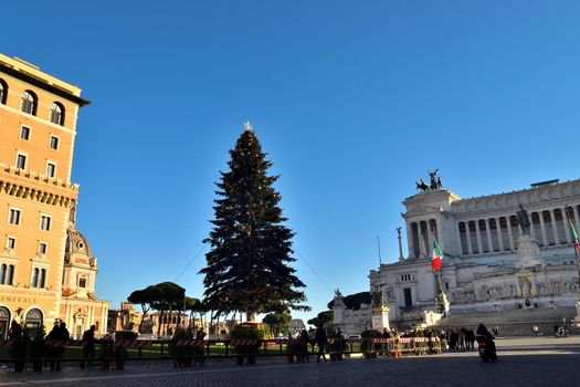 Rome, Italy - December 13th 2020: View of the famous Christmas tree in Piazza Venezia with few tourists due to the Covid19 epidemic.