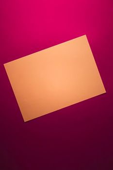 Blank A4 paper, brown on pink background as office stationery flatlay, luxury branding flat lay and brand identity design for mockup.