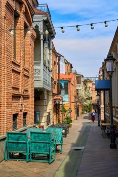 Summer terrace and restaurant table on the street in a cozy old district of Tbilisi.