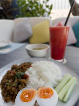 Thaifood basil chicken with boiled egg, stock photo