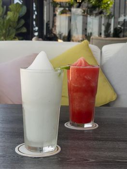 Lime smoothie in glass on grey table, stock photo