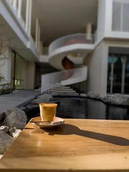 Hot coffee on wooden table, stock photo