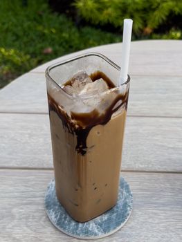 Iced coffee on wooden table, stock photo