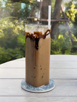 Iced coffee on wooden table, stock photo