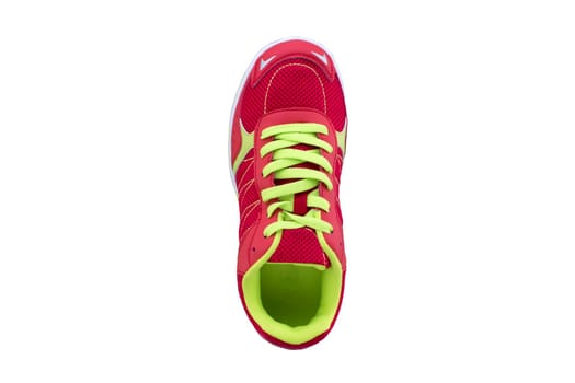 Red sneaker with green laces on a white sole. Sport shoes on white background