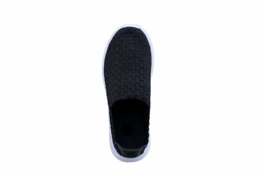 Black sneakers on white soles. Sport shoes on a white background.