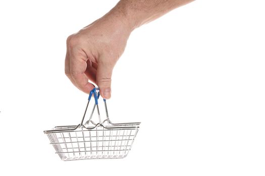 Hand holds an empty shopping cart from the supermarket on a white background, template for designers.