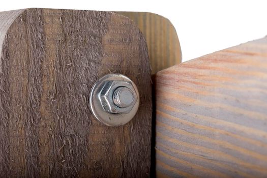 Fragment of a wooden pollock with a screw close-up on a white background