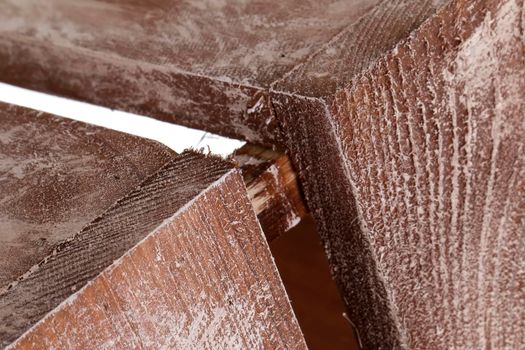 Fragment of a wooden box close-up on a white background