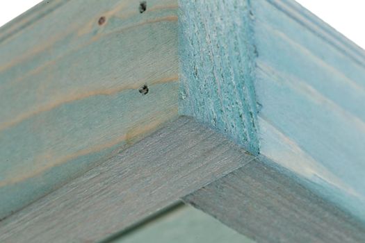 Fragment of a wooden box on a white background close-up