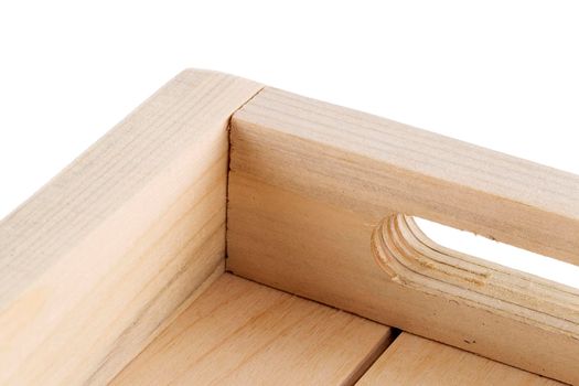 Fragment of a wooden box on a white background close-up