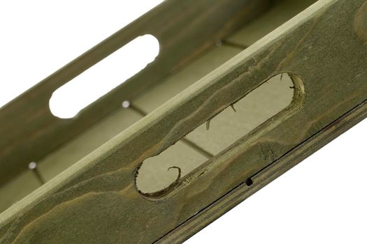 Fragment of a wooden box on a white background close-up