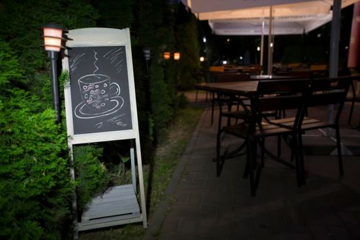 Blackboard on the background of the bar. Empty menu in the evening restaurant