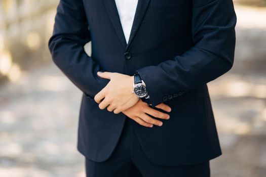 Man's hands. He crossed his fingers. Wedding in Montenegro.