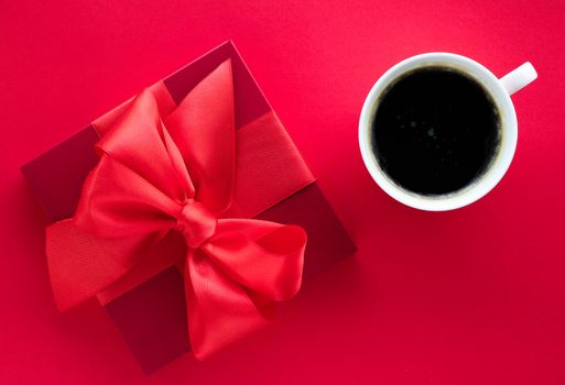 Romantic celebration, lifestyle and birthday present concept - Luxury beauty gift box and coffee on red, flatlay