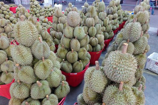 Basket full of durians at Talad Thai fruits market.