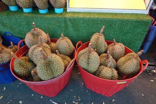 Basket full of durians at Talad Thai fruits market.