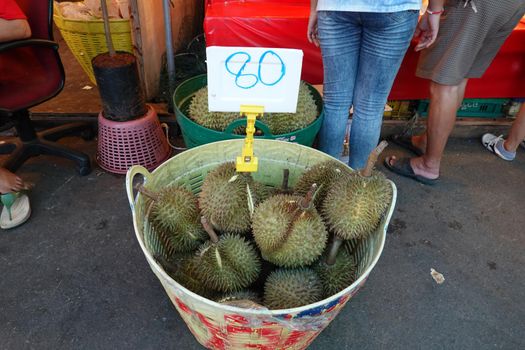 Basket full of durians at Talad Thai fruits market.