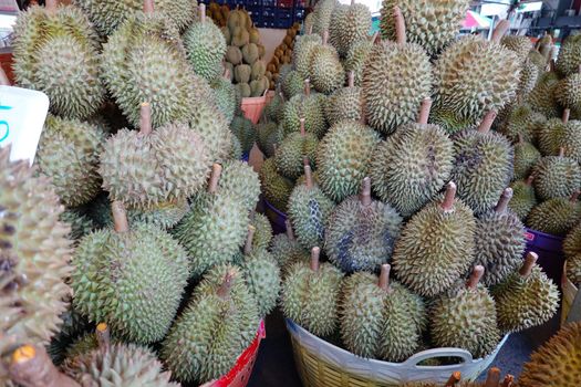 Basket full of durians at Talad Thai fruits market.