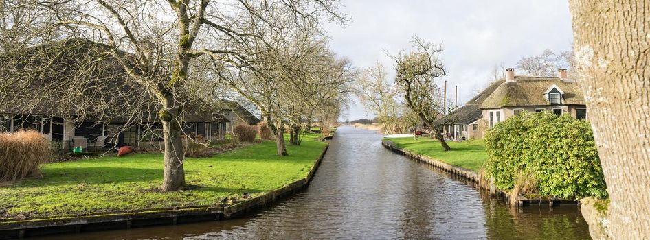 View of houses and canals in the village Dwarsgracht near Giethoorn, The Netherlands