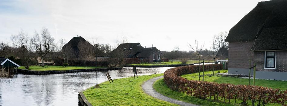 View of houses and canals in the village Dwarsgracht near Giethoorn, The Netherlands