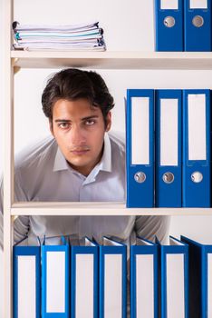 Young male employee working in the office