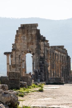 Volubilis is a site of Roman ruins and formerly a partly excavated Berber city in Morocco near the city of Meknes.The images show the ruined buildings and columns that are part of the large site High quality photo