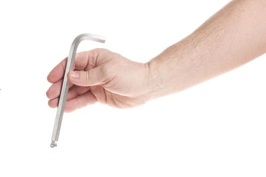 Hand holds a hex key on a white background, a template for designers. Close up