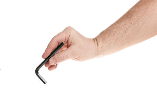 Hand holds a black hex key on a white background, a template for designers. Close up