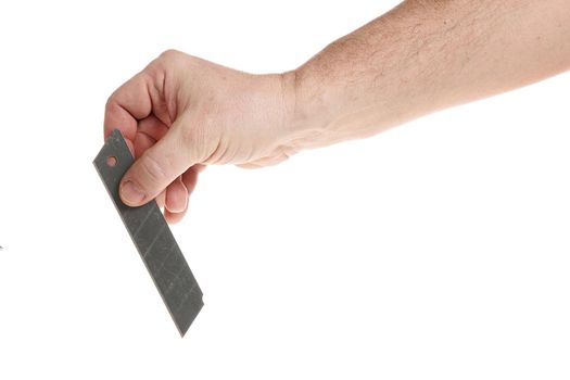 Hand holds a blade for a construction knife on a white background, a template for designers.