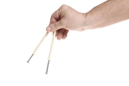 Hand holds metal screws on a white background, a template for designers. Close up