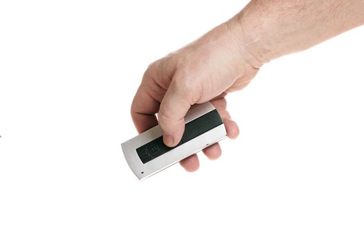 Hand holds a remote control on a white background, template for designers. Close up