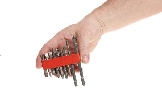 Hand holds a set of bits for a screwdriver on a white background, a template for designers.
