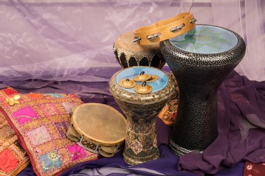 Side view of musical instruments of a bellydance percussiongroup with darbuka's, tambourines and zills