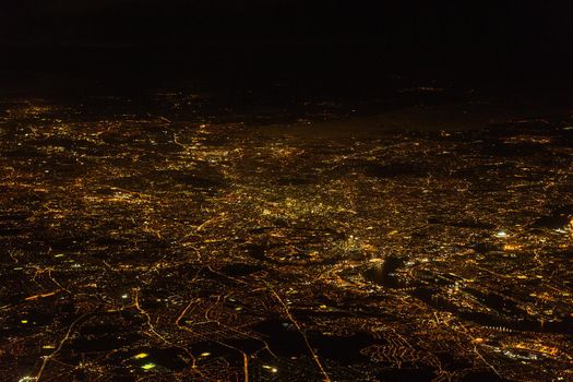 Night view of London from a plane with the river Thames, the City, Hide Park