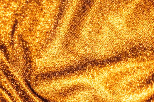 Luxe glowing texture, night club branding and New Years party concept - Golden holiday sparkling glitter abstract background, luxury shiny fabric material for glamour design and festive invitation