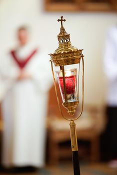 Sacred candle holder at a catholic church service