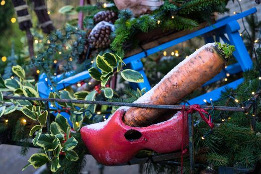 Wooden shoe (clogg) with carrot waiting for Sinterklaas and his horse to bring presents, Dutch tradition for children to get presents