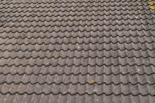 Grey roof tiles close up and full frame in rows