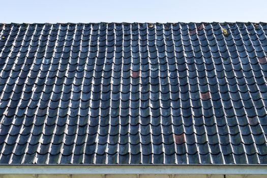 Grey roof tiles close up and full frame in rows