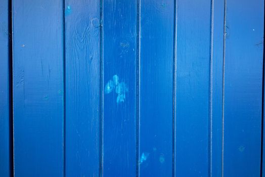 A Bright dark blue color wood plank texture. Vintage beach wooden background.