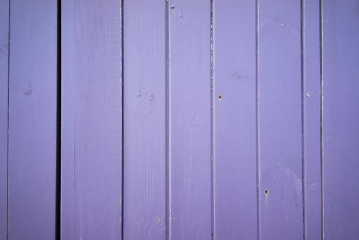 A Bright light purple color wood plank texture. Vintage beach wooden background.