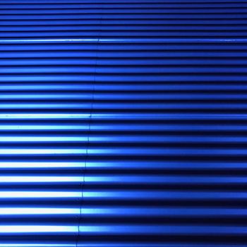 a Full frame background of blue building with corrugated iron