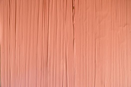 a Full frame of a terracotta painted old wall with wallpaper and vertical structured lines