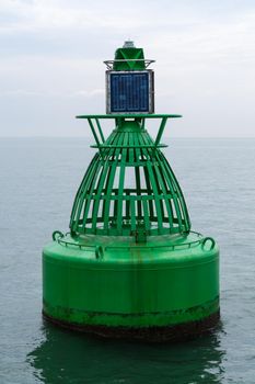 An Electric bollard light or buoy on the open sea in the esuary of the Thames, England, UK