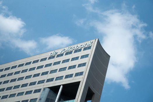 UTRECHT / NETHERLANDS - APRIL 15, 2019: DE VOLKSBANK sign at building exterior against a blue sky