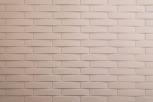 Soft pink painted brick wall with horizontal lines