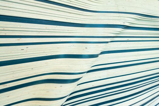 Wall structure of wood with wave pattern in horizontal lines